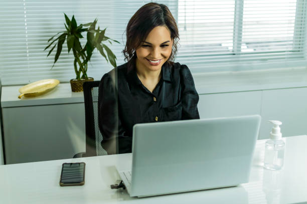istock a woman in the office, doing online service 1276020477