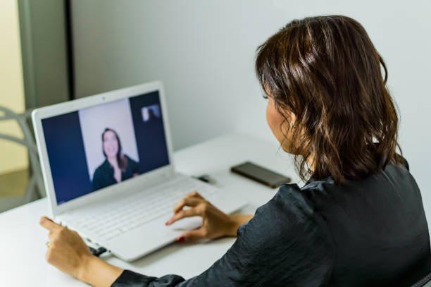 istock a woman in the office, doing online service 1276020579