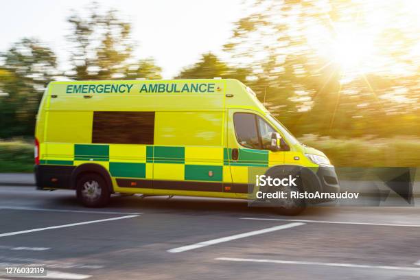 Ambulance Uk Respond To An Emergency In Downtown Stock Photo - Download Image Now - Ambulance, UK, Emergency Siren