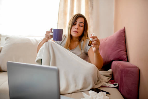 istock Sick woman with flu at home 1276032673