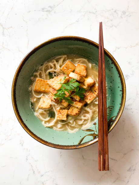Homemade tofu and miso ramen noodles soup Overhead view of simple tofu and miso ramen miso sauce stock pictures, royalty-free photos & images