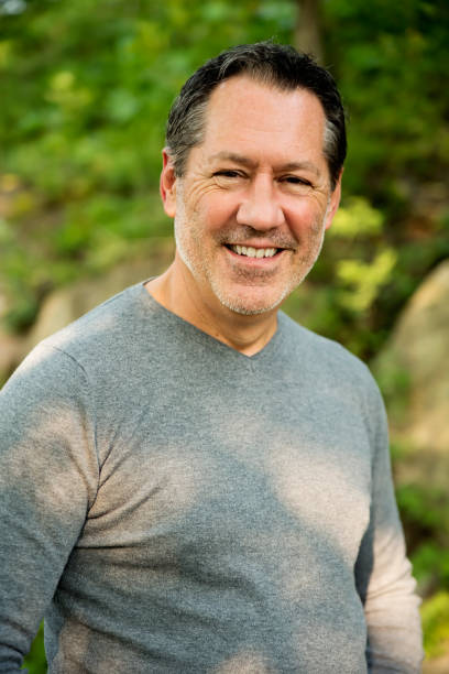 istock Mature man outdoors portrait in summer nature. 1276057662