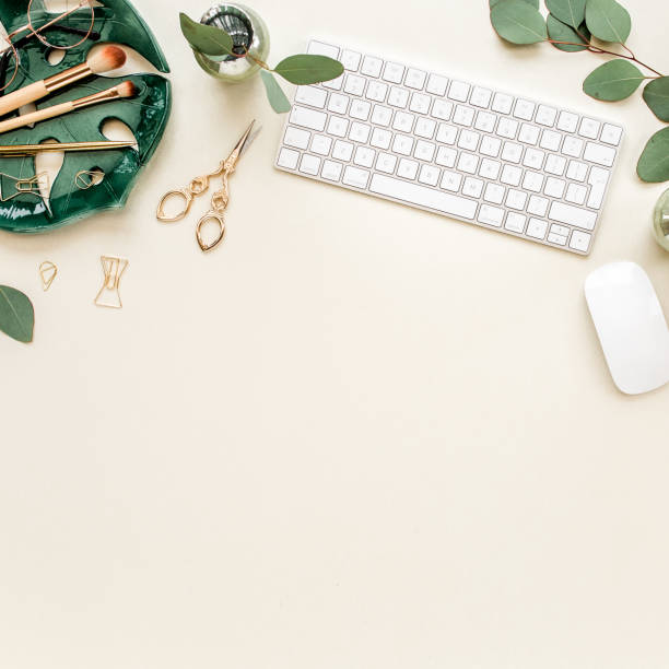 istock Flat lay home office desk. Female workspace with computer, plate sheet monstera, golden accessories, eucalyptus leaves, on beige background. Top view 1276094730