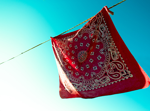 Red Bandana Hanging to Dry, Turquoise Sky
