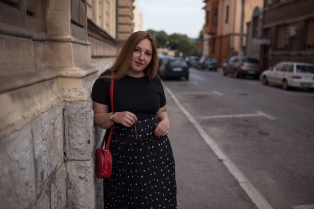 istock Confident woman walking in city 1276177144