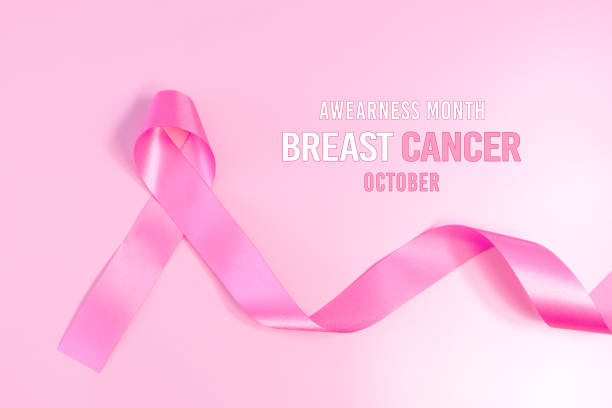 ピンクリボンシンボル。乳がん啓発月間キャンペーン - breast cancer breast cancer awareness ribbon social awareness symbol human hand ストックフォトと画像