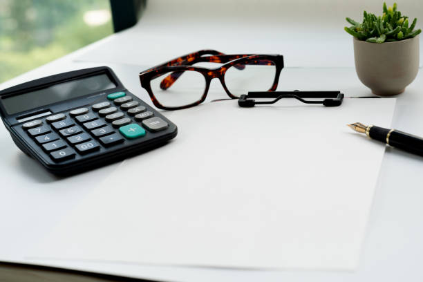 istock Business objects, clipboard with blank sheet of paper, pen, glas 1276189034