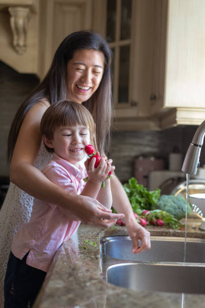 istock Mother and son work in the kitchen together 1276257005