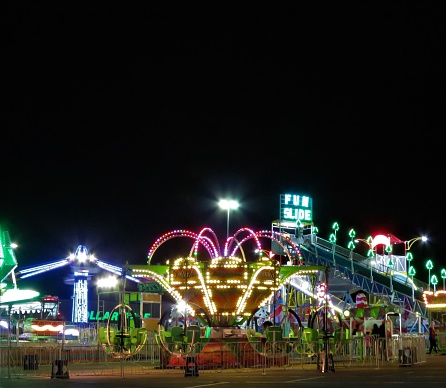 Stephenville, Texas, USA – September, 10, 2020:Amusement rides lite up at night when a traveling carnival came to town.