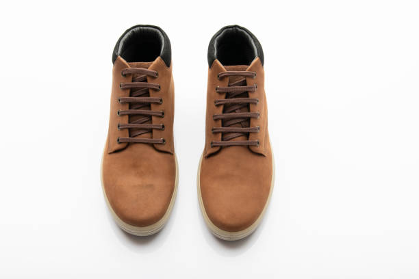 istock Pair of Brown Shoes Isolated on White Background 1276344658