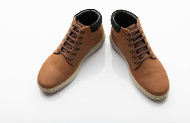 istock Pair of Brown Shoes Isolated on White Background 1276345529