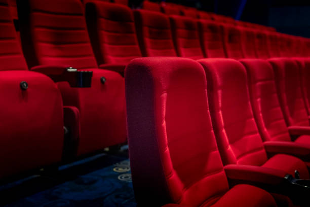 istock Empty comfortable red seats with numbers in cinema 1276351052