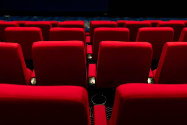istock Empty comfortable red seats with numbers in cinema 1276351059