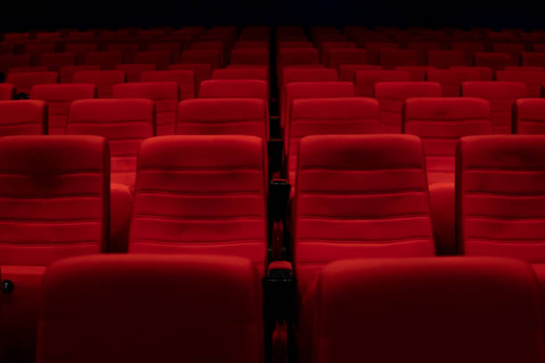 istock Empty comfortable red seats with numbers in cinema 1276351152