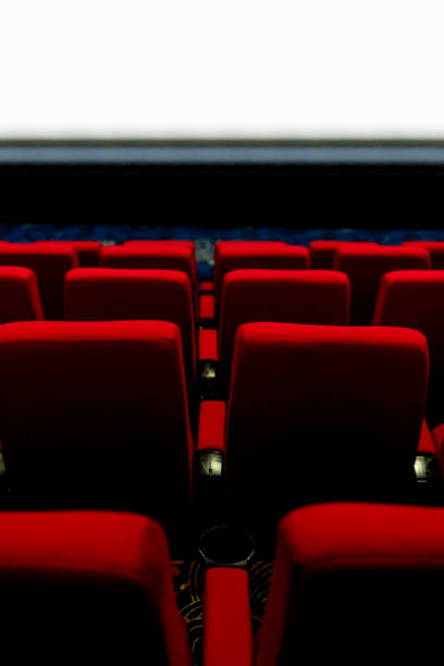 istock Empty comfortable red seats with numbers in cinema 1276351157