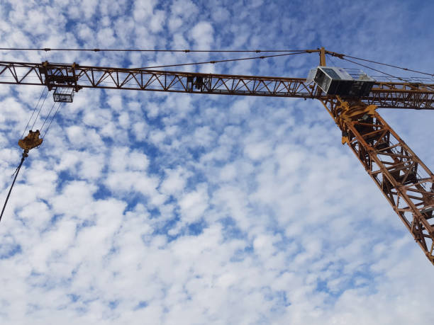 istock Stock Tower Crane at Yard The Tower Crane is lifting things at the construction site with a hook in front. 1276351837