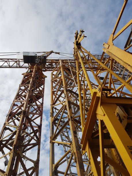 istock Stock Tower Crane at Yard The Tower Crane is lifting things at the construction site with a hook in front. 1276351853