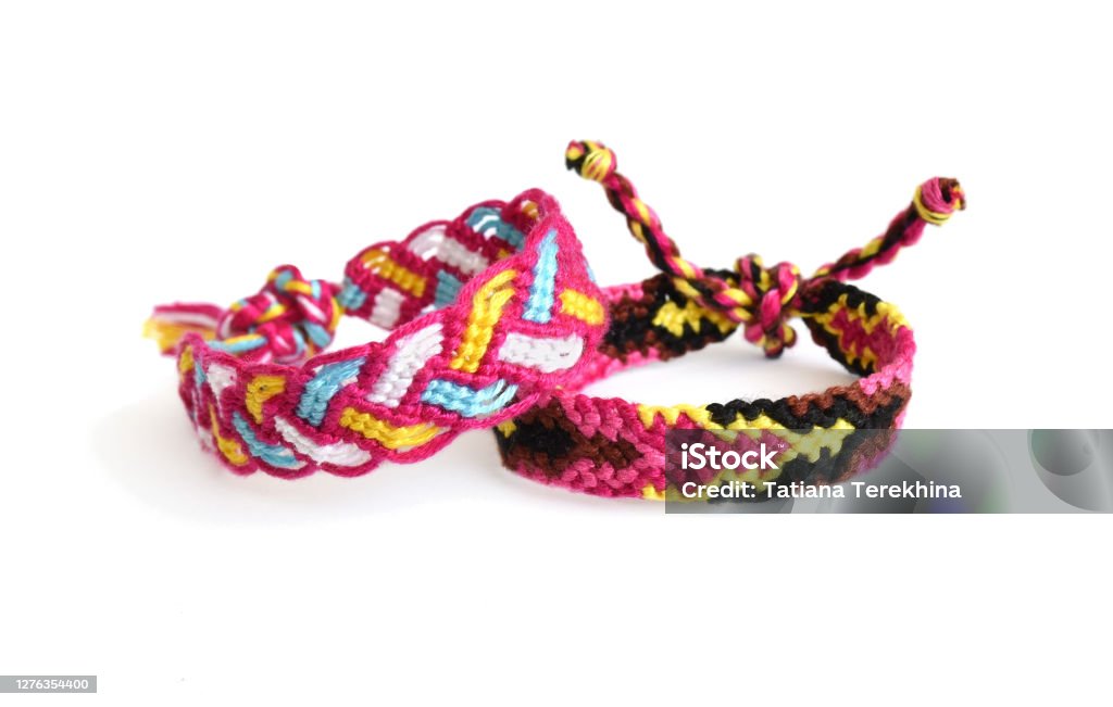 Selective Focus Of Two Tied Woven Friendship Bracelets With Bright