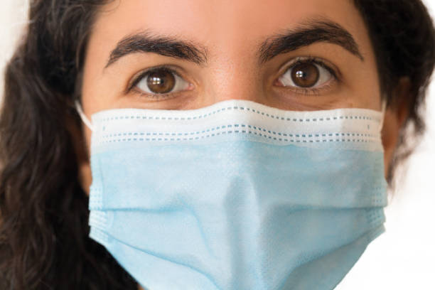 istock Young woman wearing face mask 1276356219