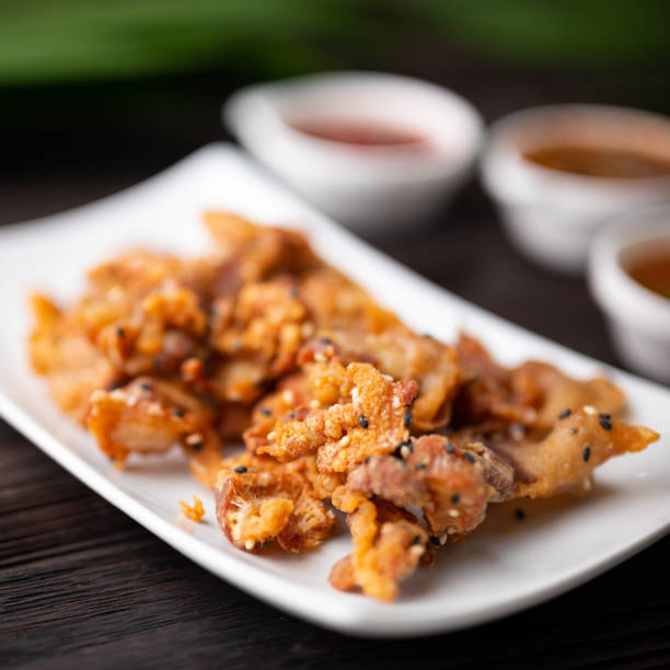 istock Crispy fried sliced belly pork with spicy sauce 1276358120