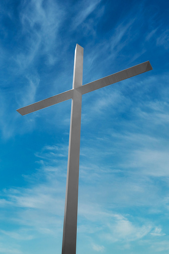 A Large Christian Cross for Jesus Christ on a Blue Sky