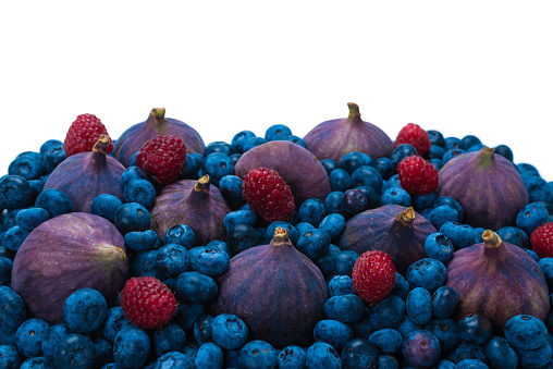 Blueberries, figs, raspberries background. Top view.