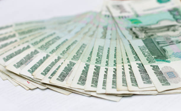 istock Scattered Russian 1000 rubles banknotes closeup isolated on the white background 1276368481