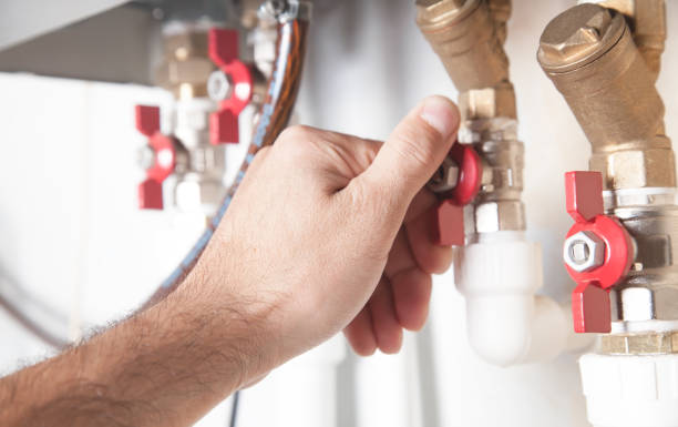 istock Male hand opens or closes the gas valve. 1276369512