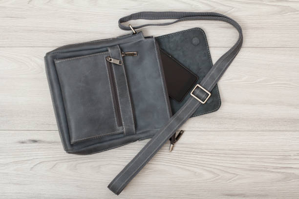 istock Leather shoulder bag for men with mobile phone on it 1276370094