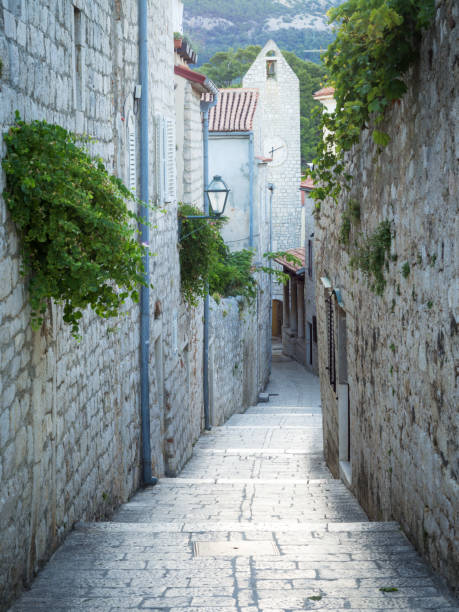 istock Narrow street and clock tower at rab Croatia 1276370482