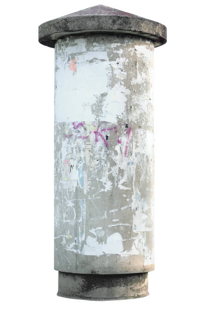 istock Grunge grey concrete advertising pillar, isolated vertical closeup, blank empty copy space background, torn adverts pieces 1276373595