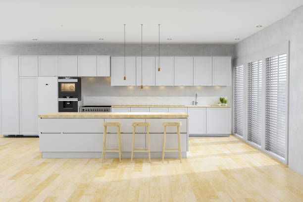 istock Kitchen With White Cabinets, Pendant Lights, Kitchen Island And Hardwood Floor 1276373720