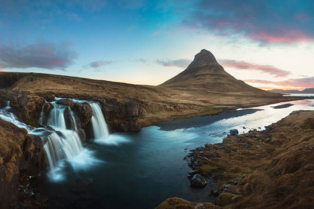 Scenic image of Iceland. Great view on famouse Mount Kirkjufell With Kirkjufell waterfall during sunset. Wonderful Nature landscape. Popular Travel destinations. Picture of wild area. Scenic image of Iceland. Great view on famouse Mount Kirkjufell With Kirkjufell waterfall during sunset. Wonderful Nature landscape. kirkjufell stock pictures, royalty-free photos & images