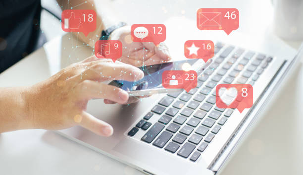 istock Businessman using smartphone with social media icon 1276376009