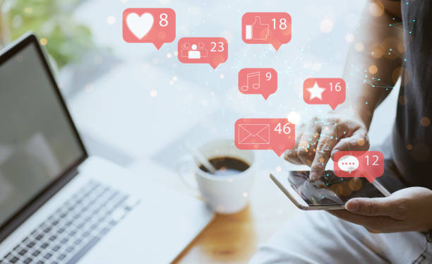 istock Businessman using smartphone with social media icon 1276376025