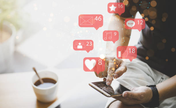 istock Businessman using smartphone with social media icon 1276376043
