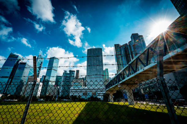 istock Cityscape outside barbed wire fence 1276380136