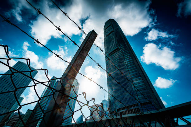 istock Cityscape outside barbed wire fence 1276380266