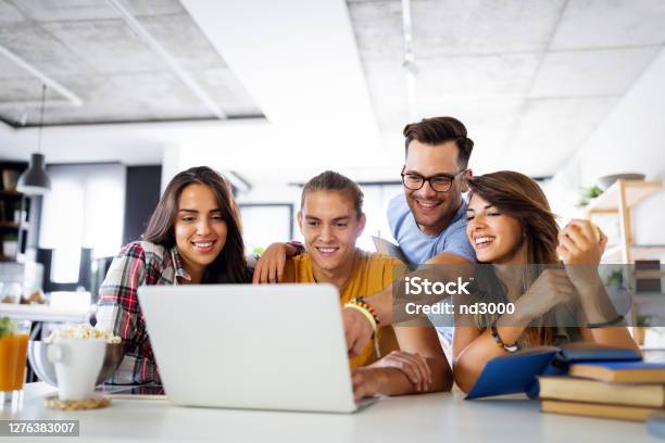 Multiracial Young People Enjoying Group Study At Table Stock Photo - Download Image Now