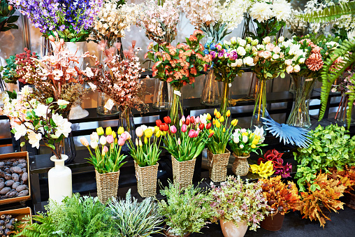 Beautiful colorful bouquets of flowers on a showcase of a flower shop
