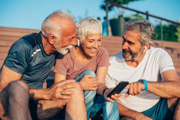 istock Group of happy seniors using smart phone after workout 1276386729