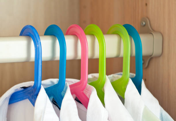 istock White shirts hang in the closet on hangers 1276392981