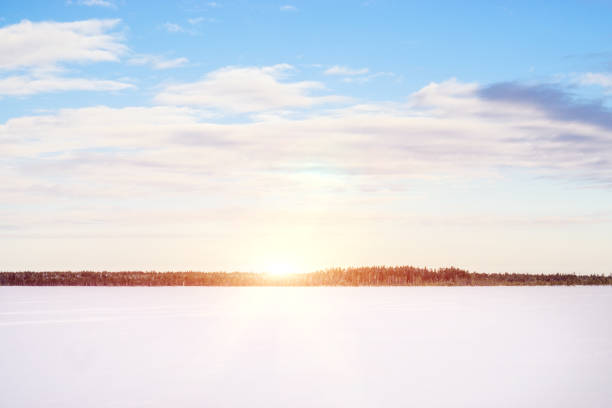 istock dawn on a winter lake in winter. with free space for text, copy space 1276396290