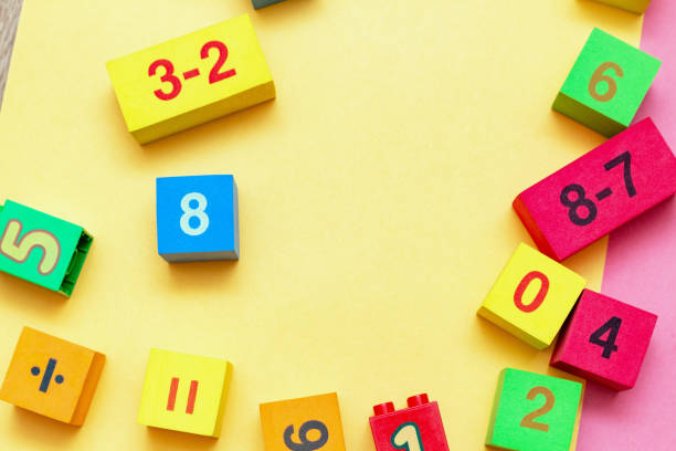 istock child kid colorful education toys cubes with numbers math pattern background on the bright background. Flat lay. Childhood infancy children babies concept. 1276396445