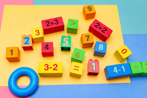 istock child kid colorful education toys cubes with numbers math pattern background on the bright background. Flat lay. Childhood infancy children babies concept. 1276396455