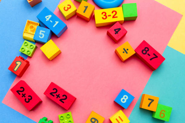 istock child kid colorful education toys cubes with numbers math pattern background on the bright background. Flat lay. Childhood infancy children babies concept. 1276396469