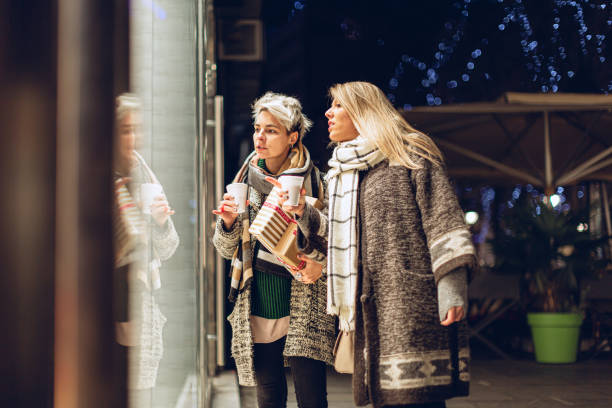 istock Lesbian couple Christmas window shopping 1276396939