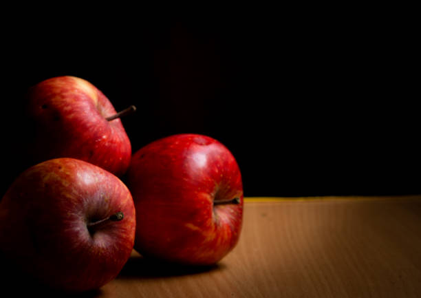 istock Juicy apples placed on a wooden table 1276397069