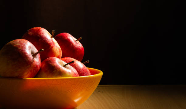 istock Juicy apples placed on a wooden table 1276397093