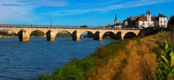 istock Old arch bridge in Macon, France 1276397350